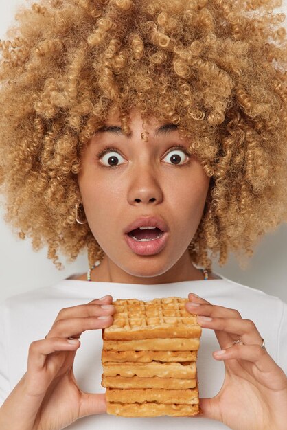 Premium Photo Vertical Shot Of Stunned Curly Haired European Woman